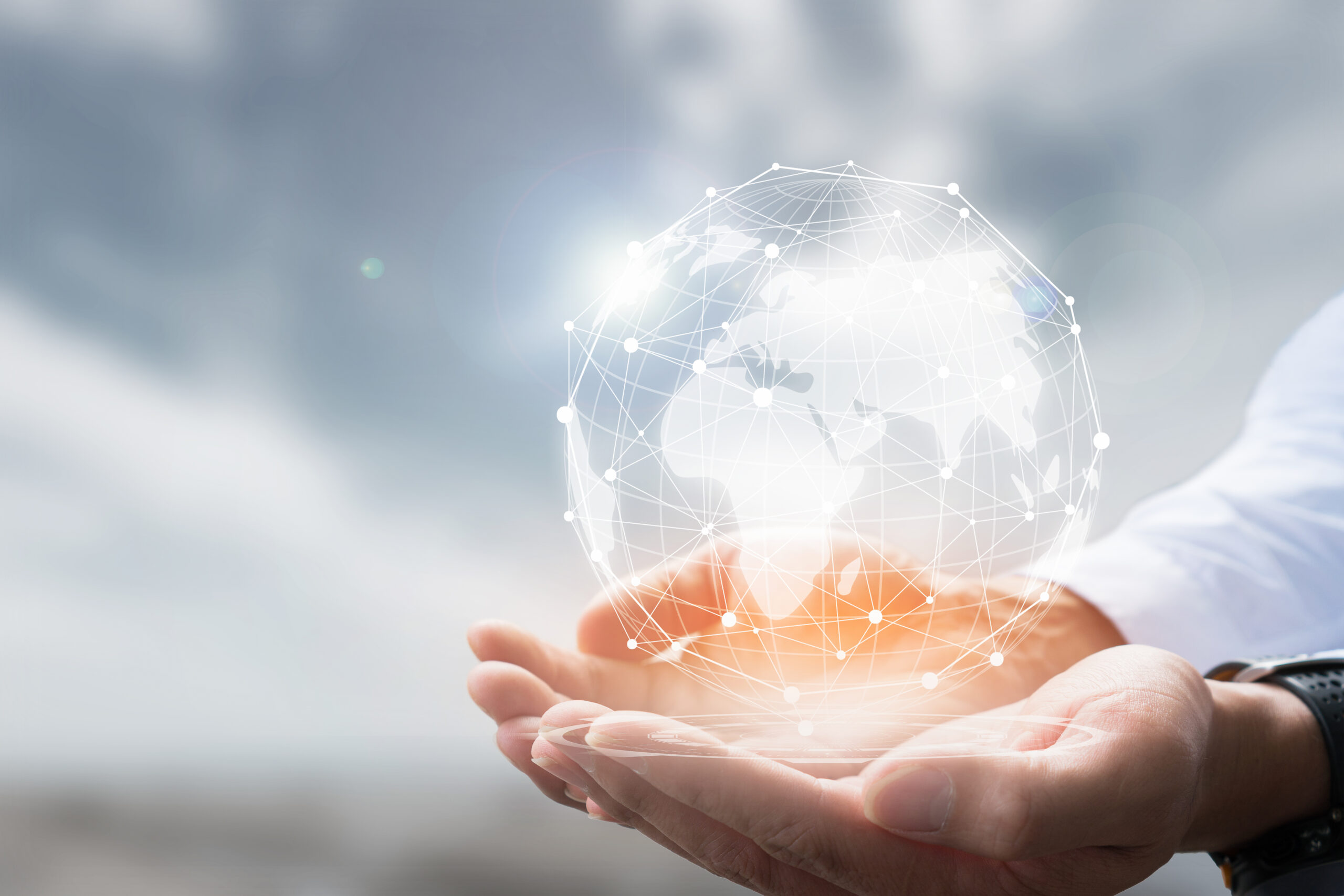 Insights - Businessman,holding,in,hand,with,global,connection,concept.